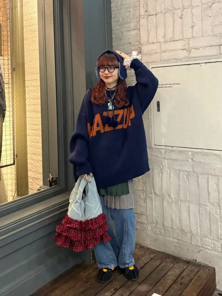 Oversized Knit With Graphic Over Plaid Shirt — Trendy Japanese Outfits