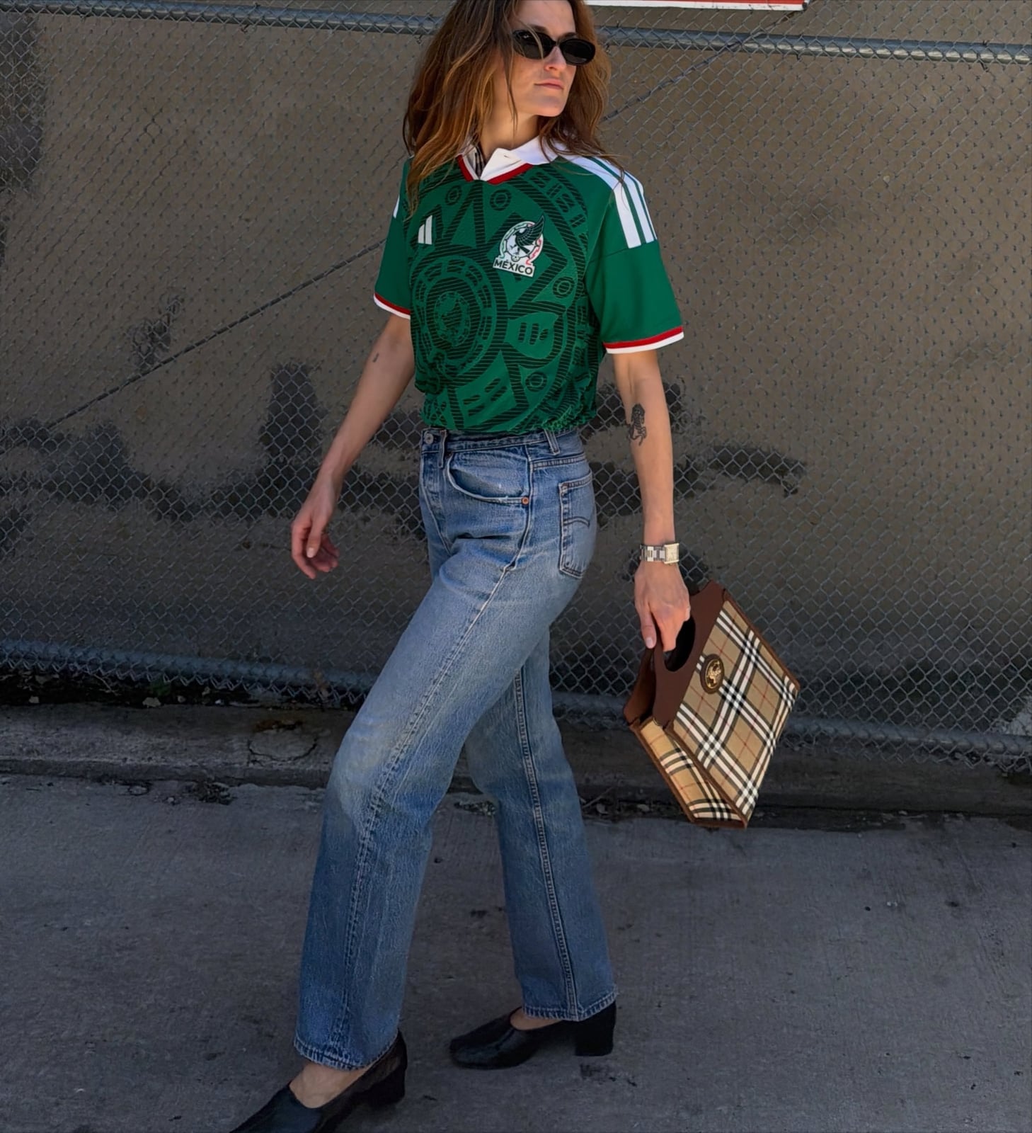 Green Soccer Jersey with Light-Wash Jeans Green Soccer Jersey with Light-Wash Jeans — Trendy Jersey Outfit