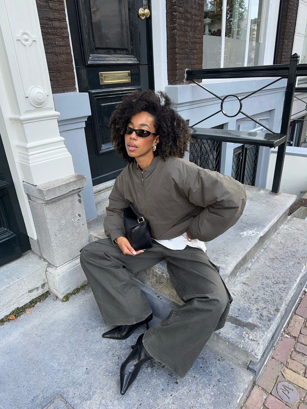 Black Kitten Heels With Cargo Pants and Bomber Jacket, Close-Up Take Black Kitten Heels With Cargo Pants and Bomber Jacket, Close-Up Take — Trendy Kitten Heels Outfits