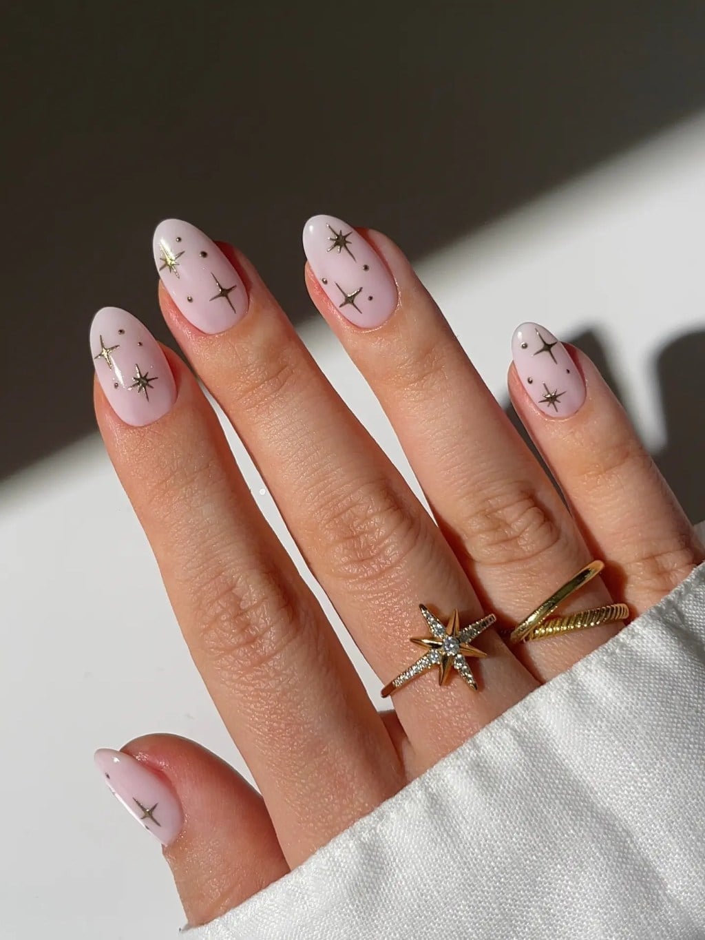 Pale Pink With Gold Star Decals Medium Almond Nails — Trendy Medium Almond Nails