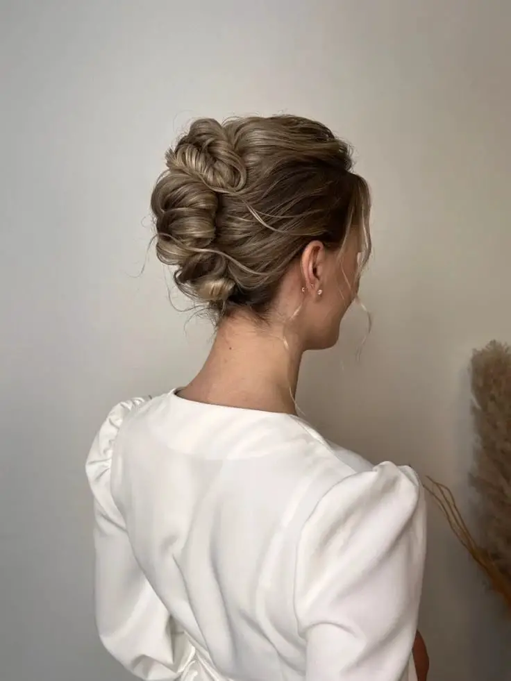 Intricate Blonde Wavy Updo Intricate Blonde Wavy Updo — Trendy Natural Bun