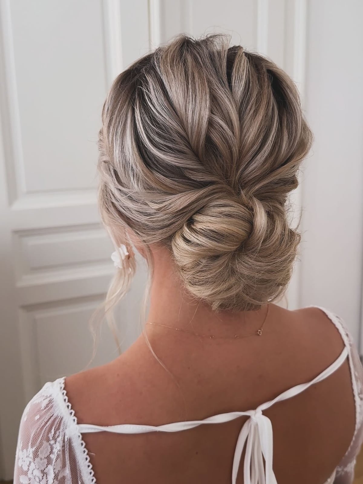 Loose Textured Ash Blonde Low Bun Loose Textured Ash Blonde Low Bun — Trendy Natural Bun