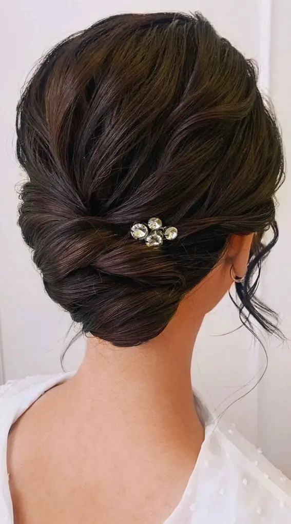 Elegant Dark Brown Wavy Low Bun With Accessory Elegant Dark Brown Wavy Low Bun With Accessory — Trendy Natural Bun