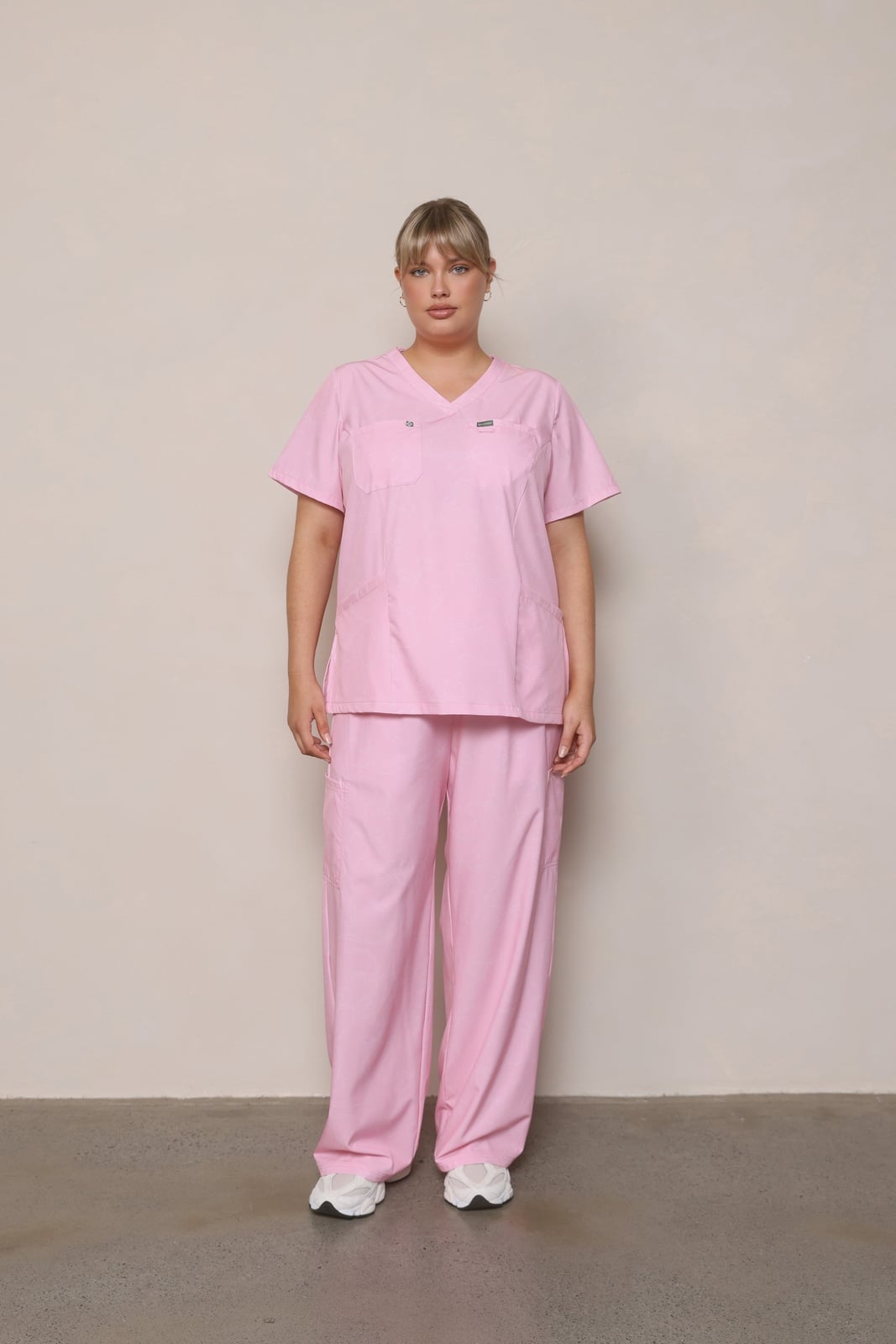 Muted Pink V-neck Scrub Set with Gold Hoop Earrings Muted Pink V-neck Scrub Set with Gold Hoop Earrings — Trendy Nurse Outfits