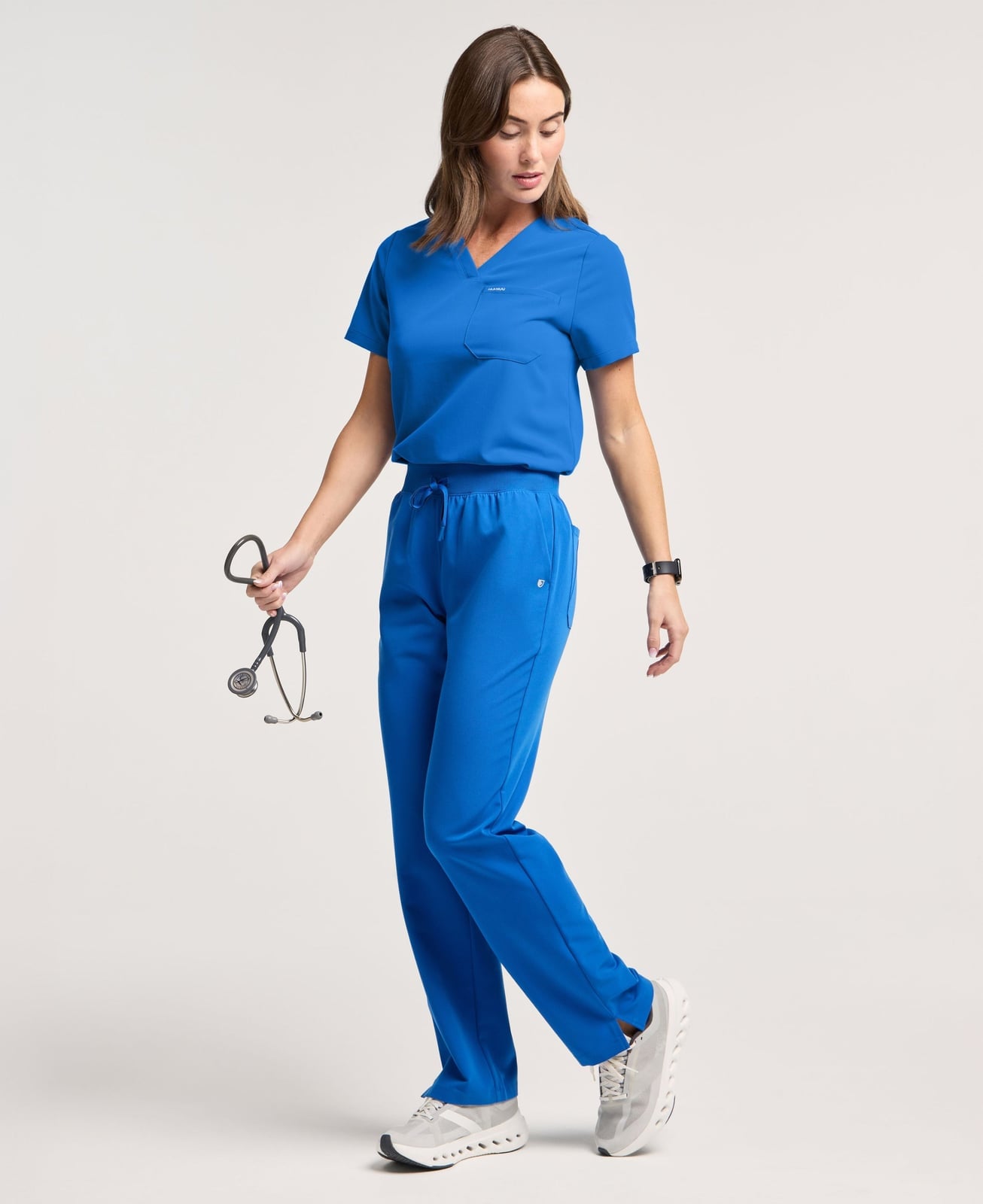 Royal Blue V-neck Scrub Set with Sneakers and Stethoscope Royal Blue V-neck Scrub Set with Sneakers and Stethoscope — Trendy Nurse Outfits