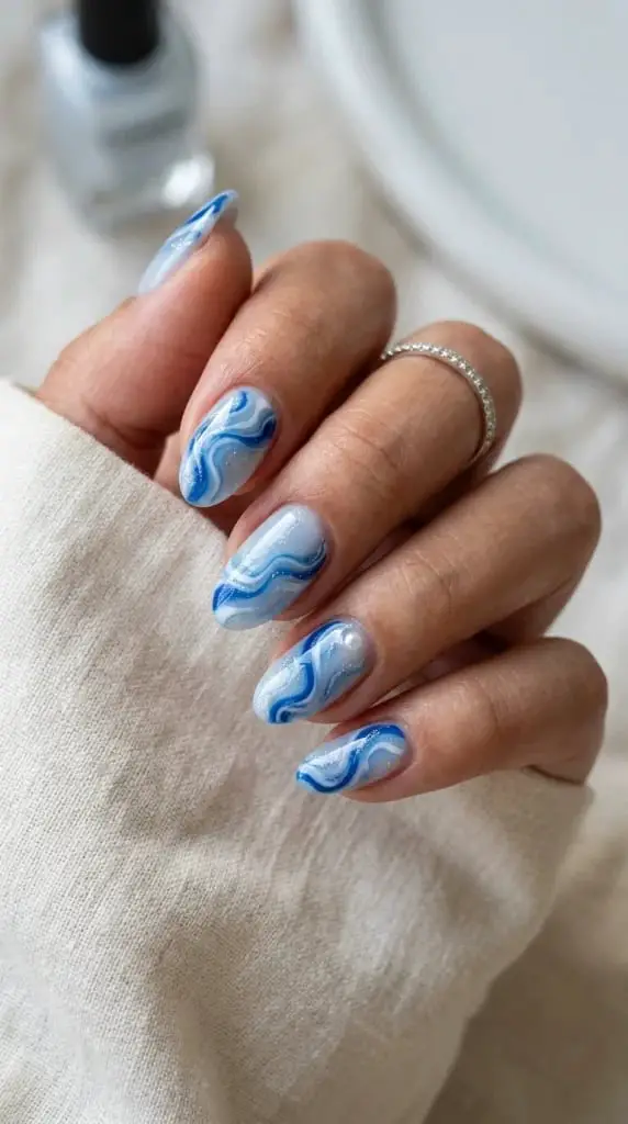 Blue Marbled Medium Almond Nails Blue Marbled Medium Almond Nails — Trendy Ocean Nails