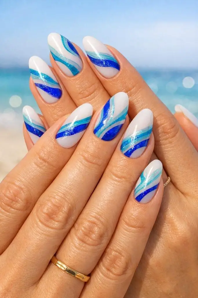 Blue Stripe Glitter Medium Almond Nails Blue Stripe Glitter Medium Almond Nails — Trendy Ocean Nails