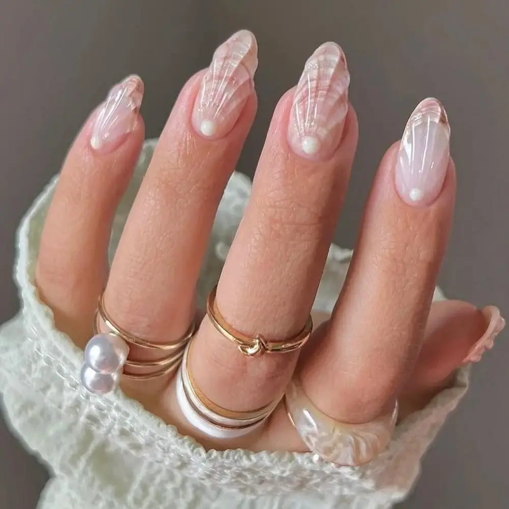 Sheer Pink Seashell Pattern Medium Almond Nails Sheer Pink Seashell Pattern Medium Almond Nails — Trendy Ocean Nails