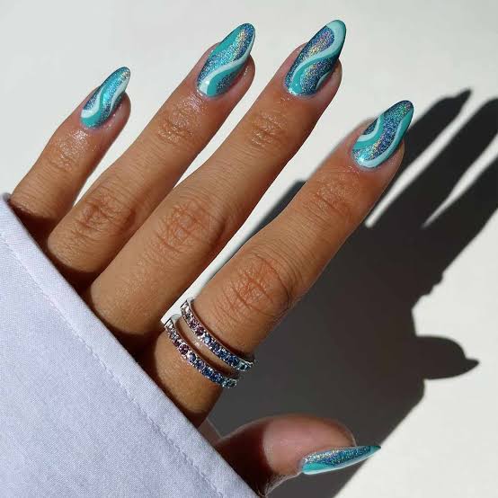 Shimmering Teal Wave Long Almond Nails Shimmering Teal Wave Long Almond Nails — Trendy Ocean Nails