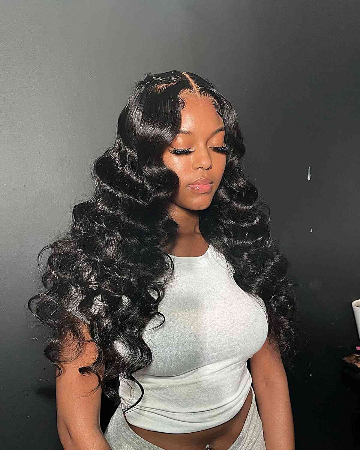 Voluminous Wavy Hair Meets Casual Tank Voluminous Wavy Hair Meets Casual Tank — Trendy Quick Weave