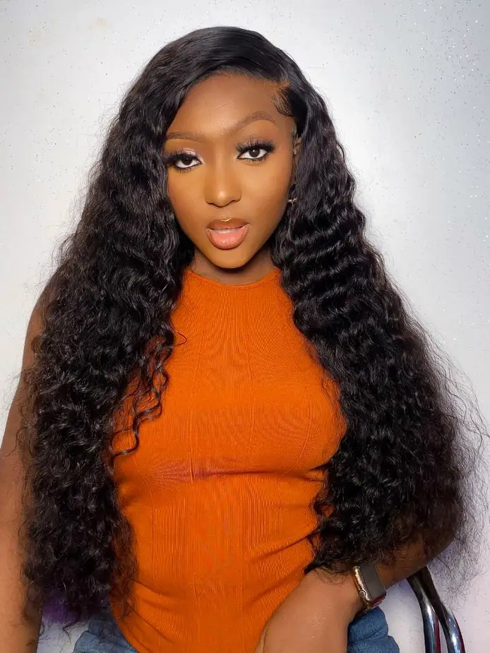 Orange Sleeveless Top with Long Wavy Hair Orange Sleeveless Top with Long Wavy Hair — Trendy Quick Weave
