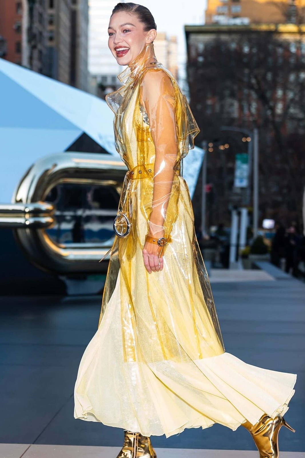 Clear Vinyl Trench Coat Over Yellow Dress Clear Vinyl Trench Coat Over Yellow Dress — Trendy Rain Jacket Outfits