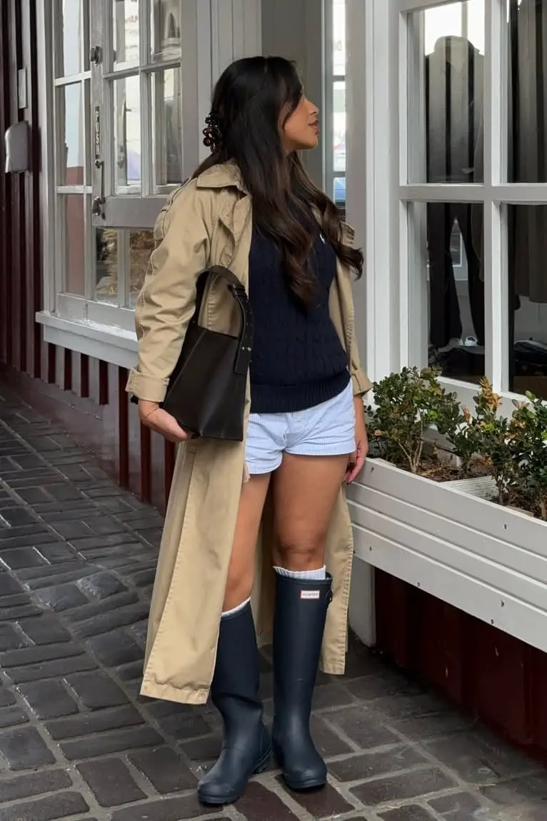 Beige Trench Coat With Sweater Vest and Shorts Beige Trench Coat With Sweater Vest and Shorts — Trendy Rain Jacket Outfits