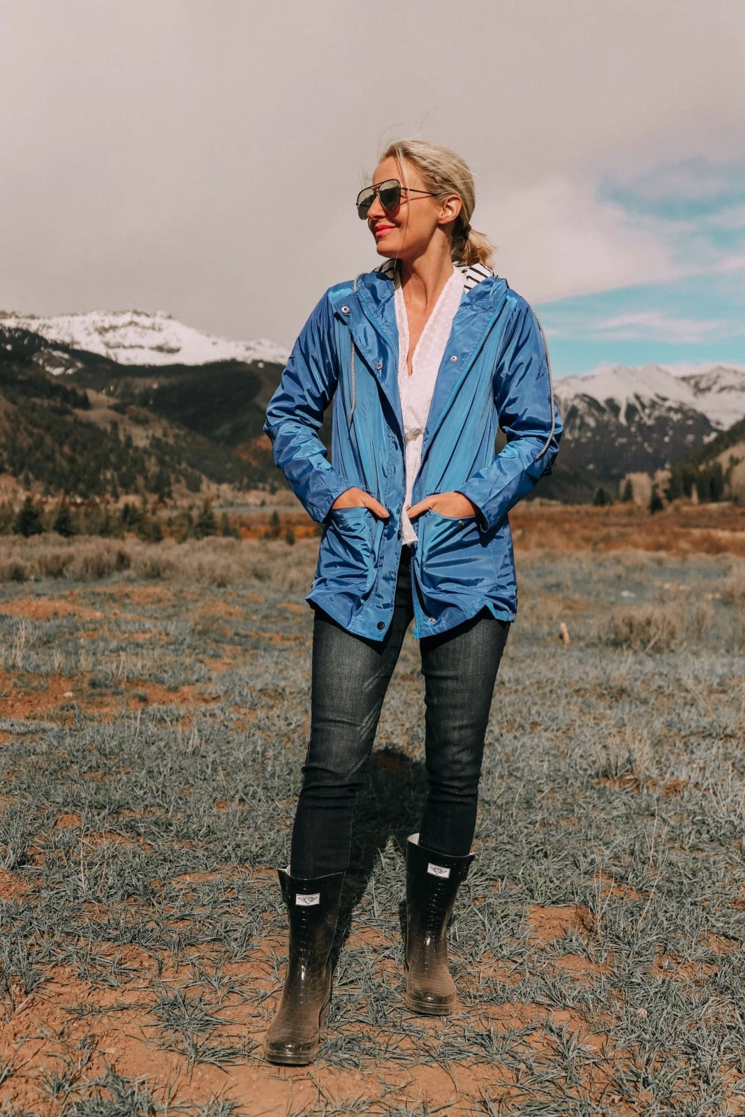 Bright Blue Hooded Rain Jacket With Fitted Jeans Bright Blue Hooded Rain Jacket With Fitted Jeans — Trendy Rain Jacket Outfits