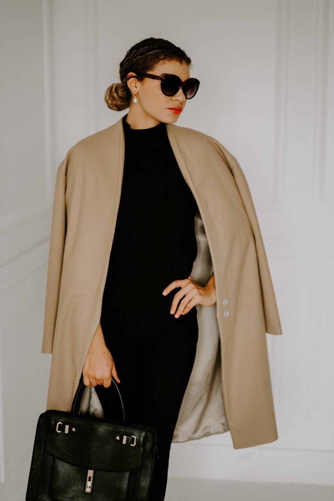 Black Turtleneck with Camel Coat Draped Over Shoulders Black Turtleneck with Camel Coat Draped Over Shoulders — Trendy Rich Outfits