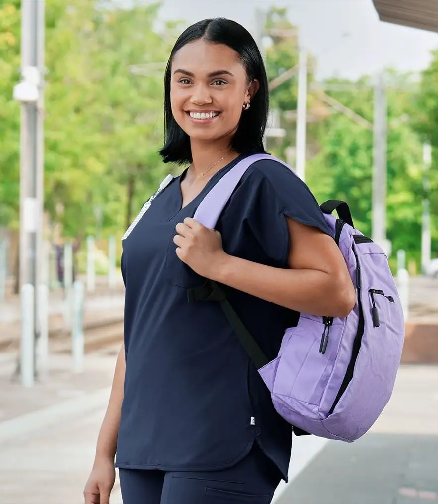Navy Scrubs With Lavender Backpack and Fitted Top — Trendy Scrubs Outfits