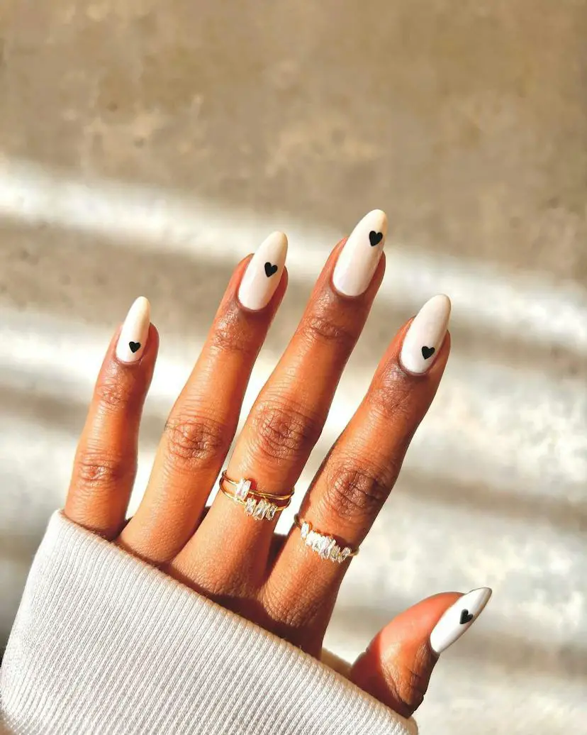 Creamy Off-White Black Heart Medium Almond Nails Creamy Off-White Black Heart Medium Almond Nails — Trendy Short Almond Nails