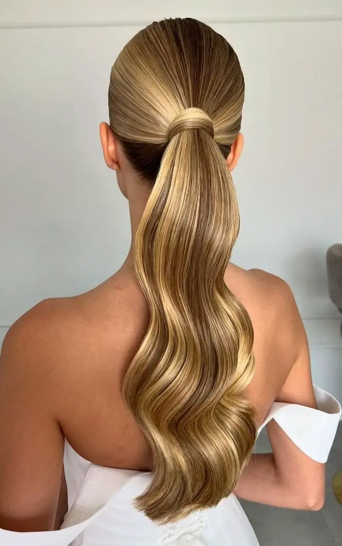 High Ponytail With Glossy Blonde Balayage Waves — Trendy Sleek Ponytail
