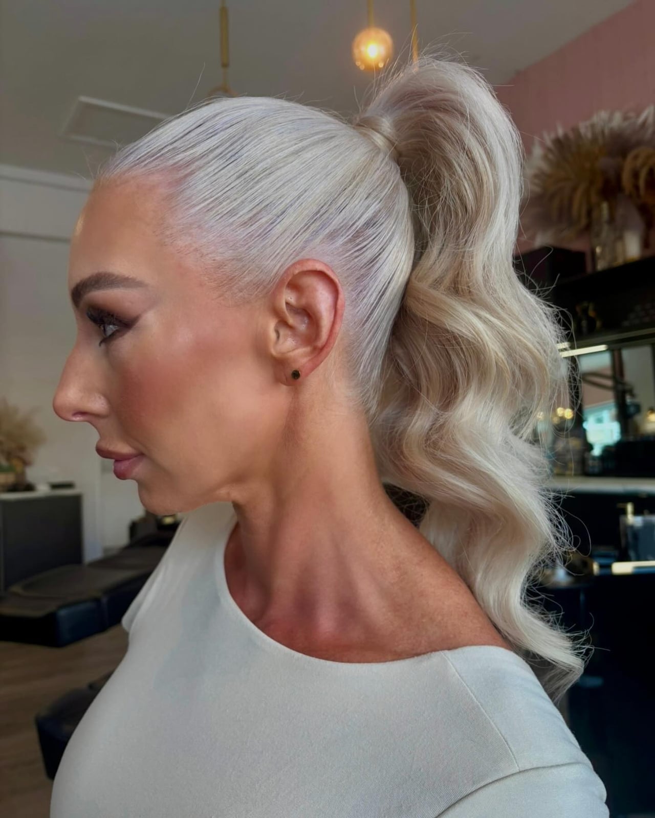 High Platinum Blonde Ponytail With Soft Waves — Trendy Sleek Ponytail