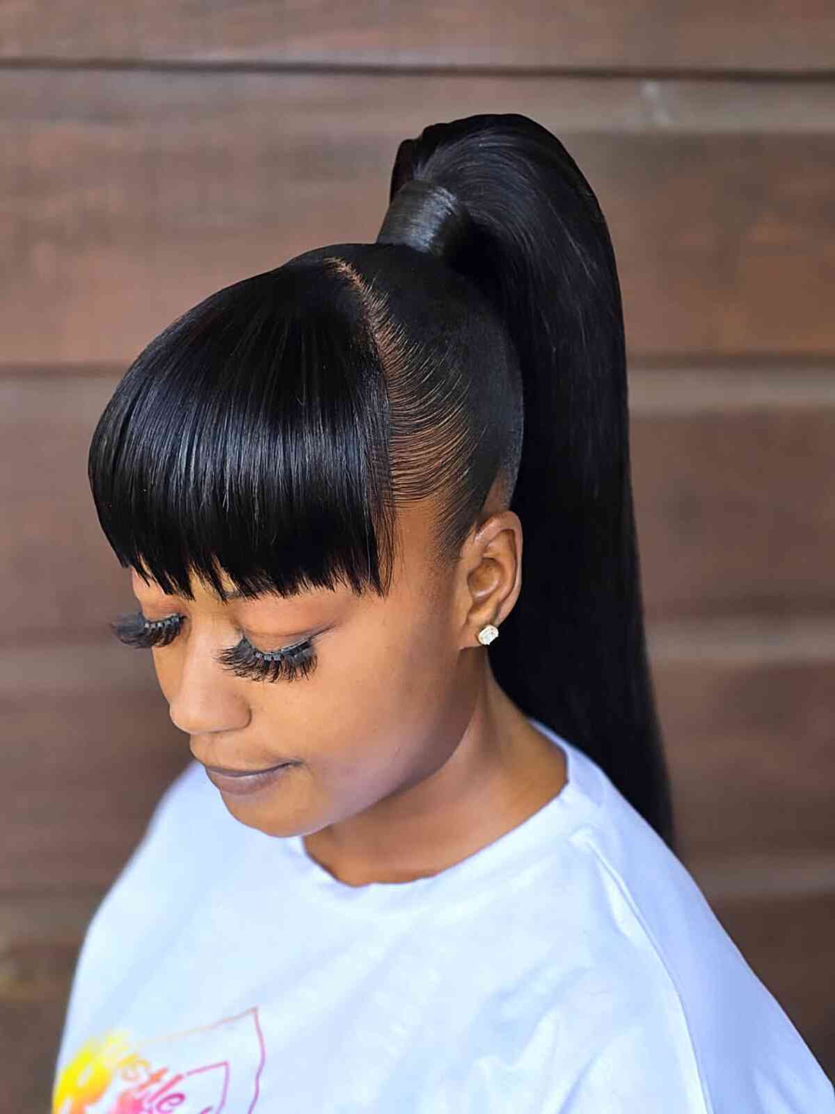 High Ponytail With Black Blunt Bangs — Trendy Sleek Ponytail