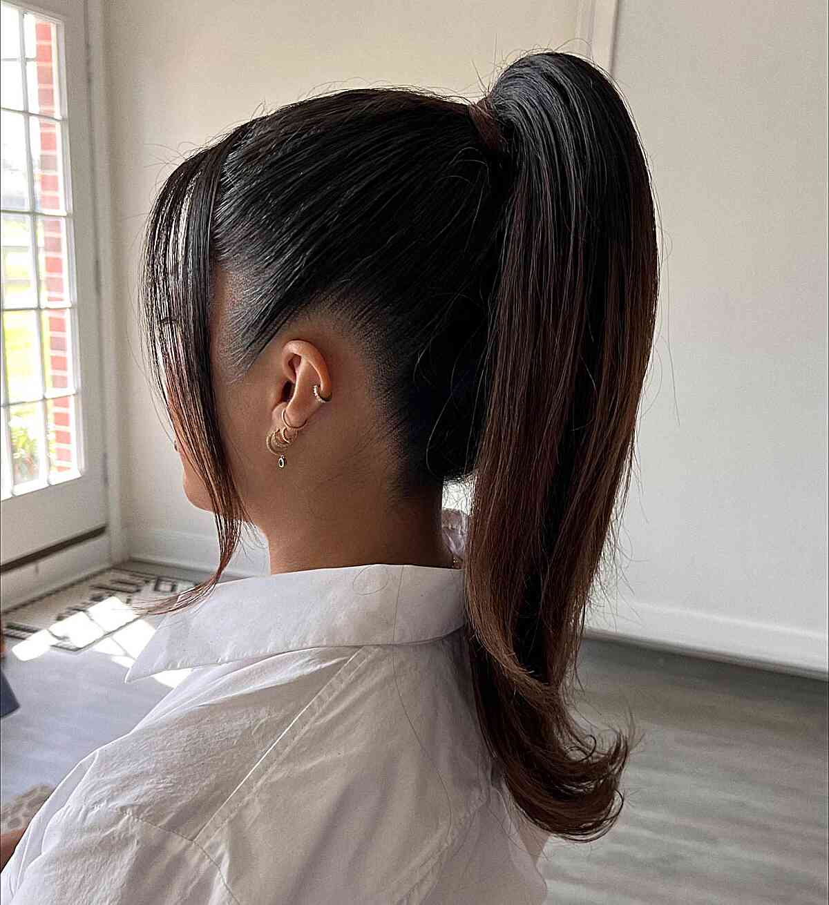 Sleek Mid-Back Dark Brown Ponytail, Close-Up Take Sleek Mid-Back Dark Brown Ponytail, Close-Up Take — Trendy Slick Back Ponytail