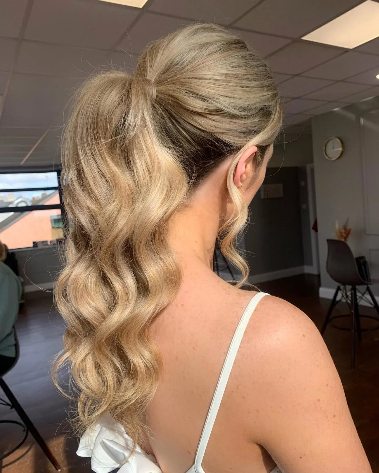 Voluminous Wavy Ash Blonde Ponytail Voluminous Wavy Ash Blonde Ponytail — Trendy Slick Back Ponytail