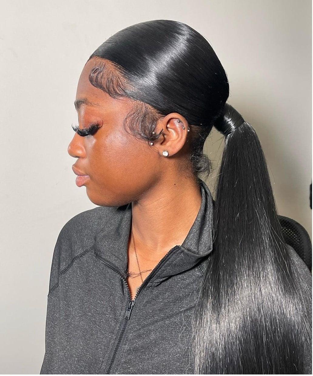 Black Ponytail with Styled Baby Hairs Black Ponytail with Styled Baby Hairs — Trendy Slick Back Ponytail
