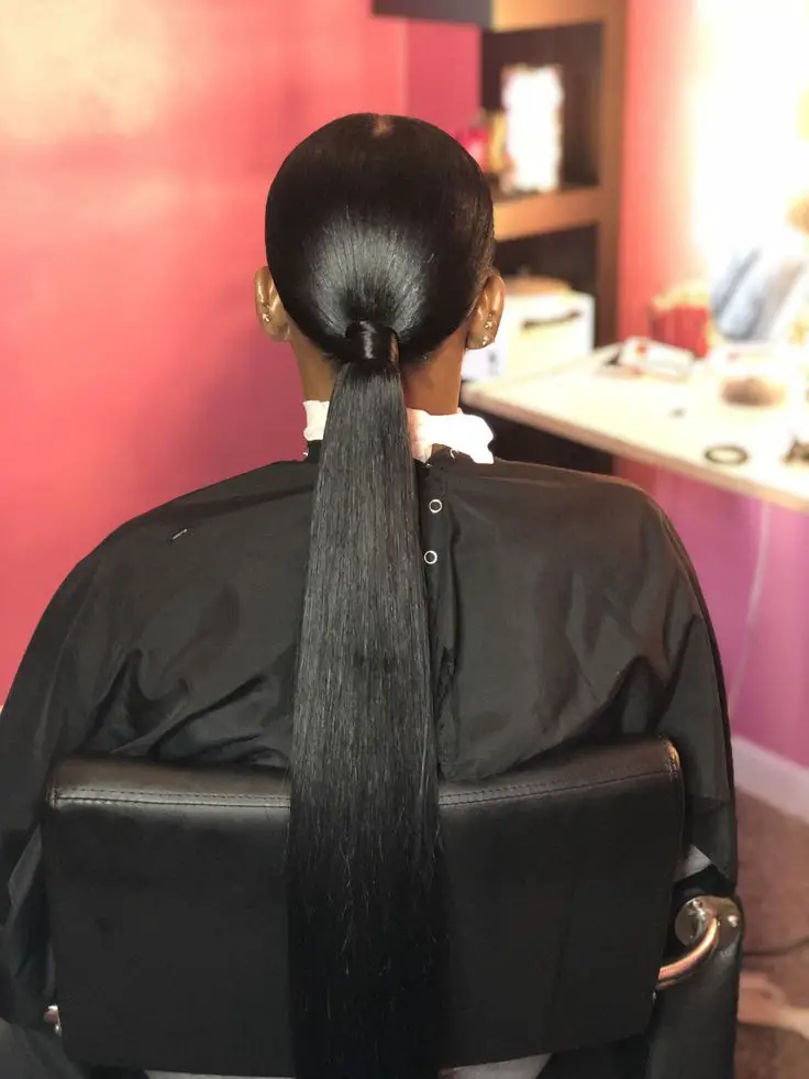 Ultra-Sleek Low Black Ponytail Ultra-Sleek Low Black Ponytail — Trendy Slick Back Ponytail