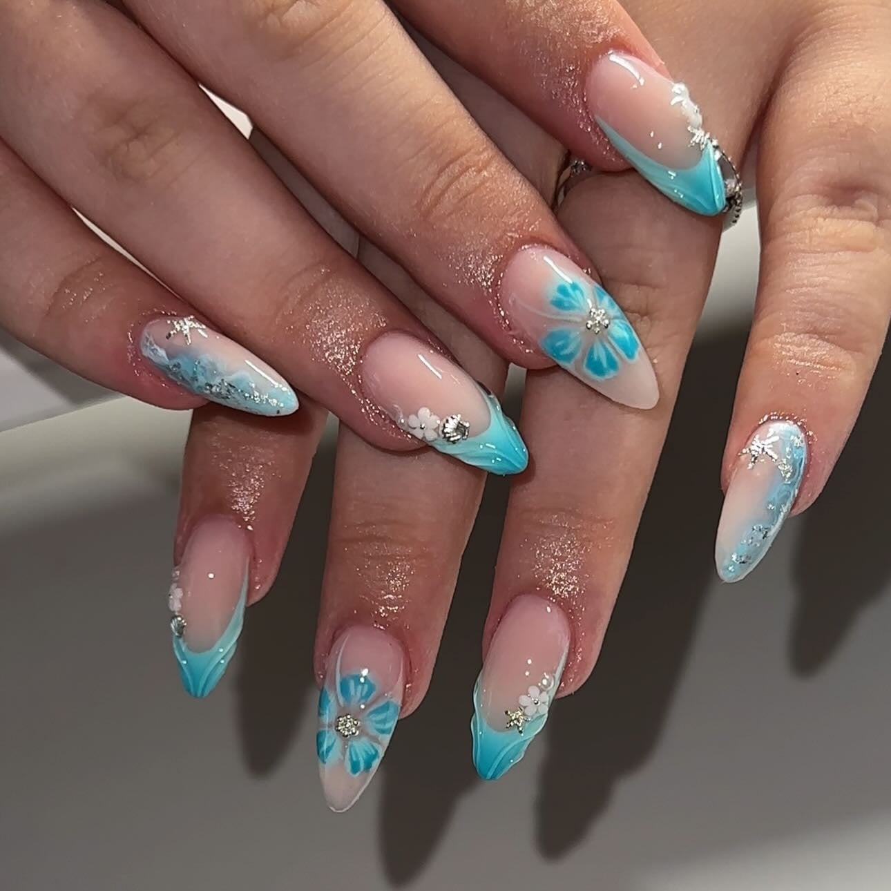 Turquoise French Tips with Floral Art Turquoise French Tips with Floral Art — Trendy Turquoise Nails