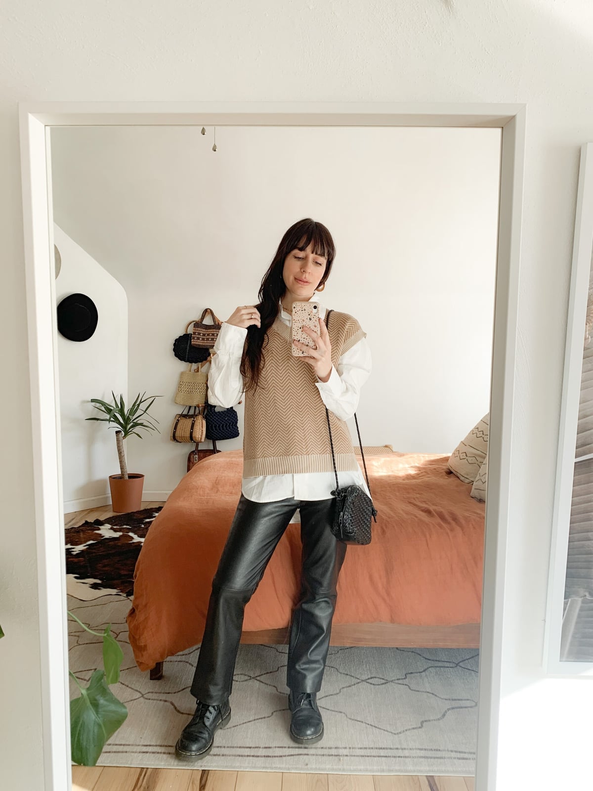 Beige Knit Vest Over Collared Shirt and Leather Pants Beige Knit Vest Over Collared Shirt and Leather Pants — Trendy Vest Outfits