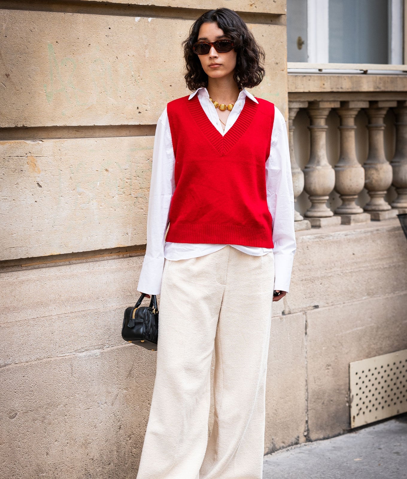 Red V-Neck Knit Vest Over White Shirt and Cream Pants Red V-Neck Knit Vest Over White Shirt and Cream Pants — Trendy Vest Outfits