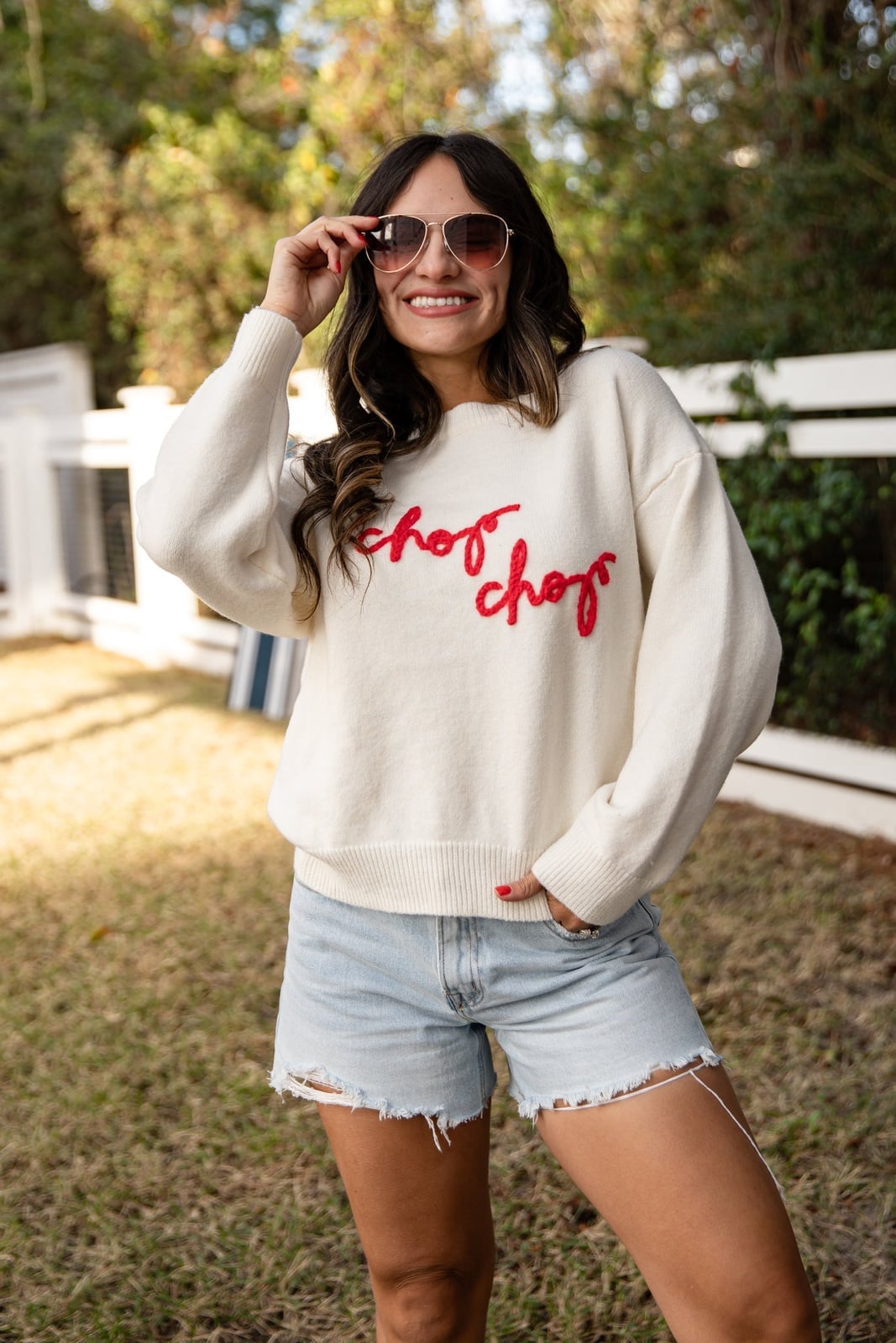 Oversized White Sweater with Red Script and Denim Shorts Oversized White Sweater with Red Script and Denim Shorts — Trendy White Sweater Outfit